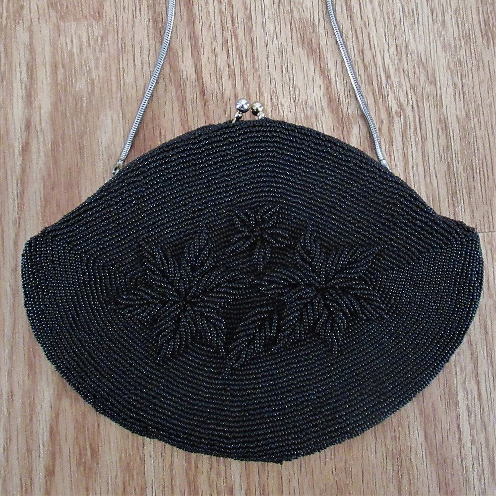 Vtg black beaded small purse w/ hand chain strap.